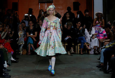 A model presents a creation by Indian designer Manish Arora as part of his Spring/Summer 2017 women's ready-to-wear collection during Fashion Week in Paris, France September 29, 2016. REUTERS/Gonzalo Fuentes