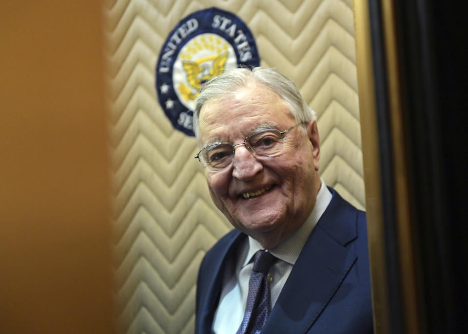 FILE - Former Vice President Walter Mondale smiles as he gets on an elevator on Capitol Hill in Washington, Jan. 3, 2018. Biden plans to speak at a memorial service in Minnesota on Sunday, May 1, for Mondale, who died last April at age 93. (AP Photo/Susan Walsh, File)