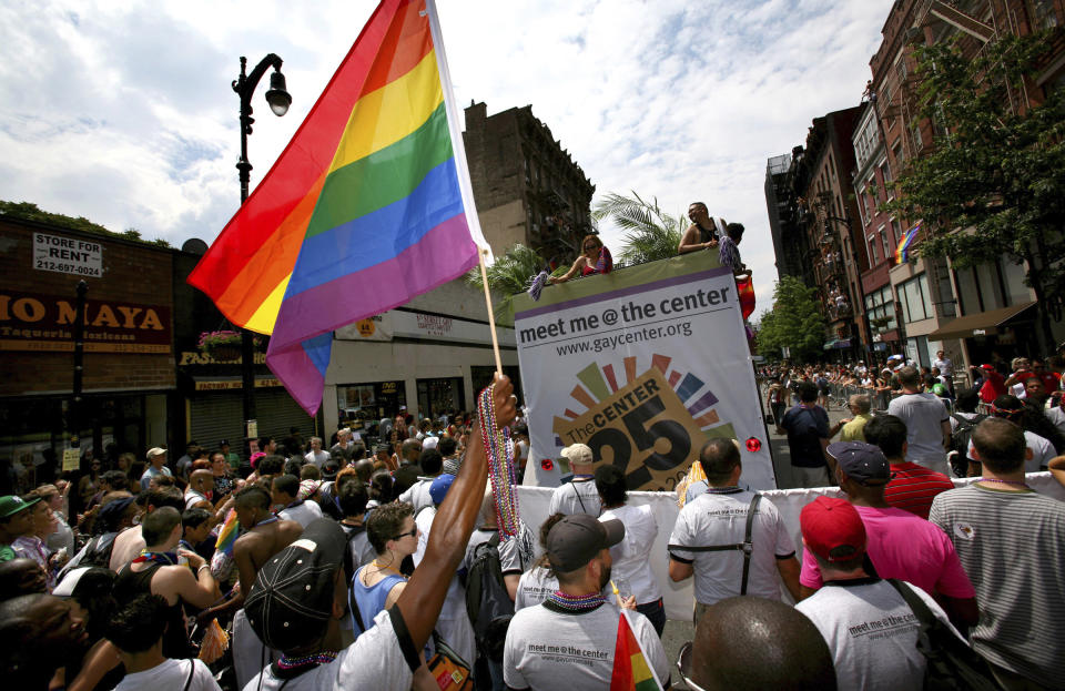 FILE - In this June 29, 2008 file photo, a crowd surges along Eighth Street as marchers pack the street during the gay pride parade in New York. Organizers of New York City’s Pride events said Saturday, May 15, 2021 they are banning police and other law enforcement from marching in their huge annual parade until at least 2025 and will also seek to keep on-duty officers a block away from the celebration of LGBTQ people and history. (AP Photo/Craig Ruttle, File)