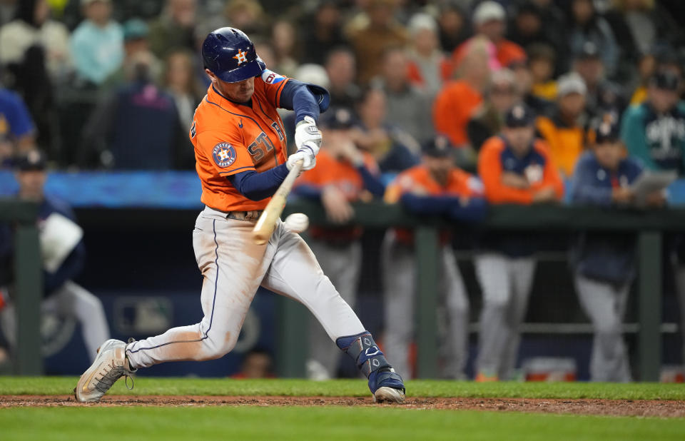 Houston Astros' Alex Bregman hits a single against the Seattle Mariners during the seventh inning of a baseball game Wednesday, Sept. 27, 2023, in Seattle. Bregman reached third on an error. (AP Photo/Lindsey Wasson)