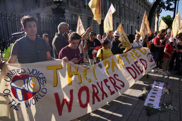 Cleaners stage a protest outside Downing Street in London, following revelations in Sue Gray's report. (Photo: Jonathan Brady - PA Images via Getty Images)