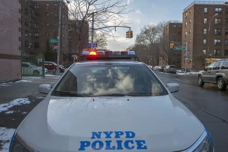 A New York Police Department patrol vehicle is seen near the Marcy Houses public housing development in the Brooklyn borough of New York January 9, 2015. REUTERS/Stephanie Keith