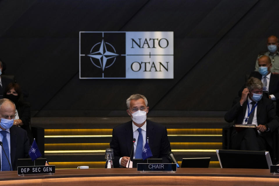 NATO Secretary General Jens Stoltenberg, center, speaks during a NATO Foreign Ministers video meeting following developments in Afghanistan at the NATO headquarters in Brussels, Friday, Aug. 20, 2021. (AP Photo/Francisco Seco, Pool)