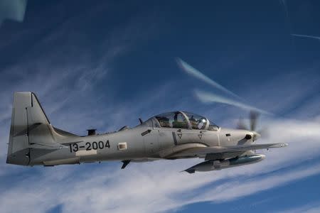 U.S. Air Force Capt. Matthew Clayton, an 81st Fighter Squadron instructor pilot, flies an A-29 Super Tucano in the skies over Moody Air Force Base, Georgia, U.S., March 5, 2015. U.S. Air Force/Senior Airman Ryan Callaghan//Handout via Reuters ATTENTION EDITORS - THIS IMAGE WAS PROVIDED BY A THIRD PARTY. EDITORIAL USE ONLY