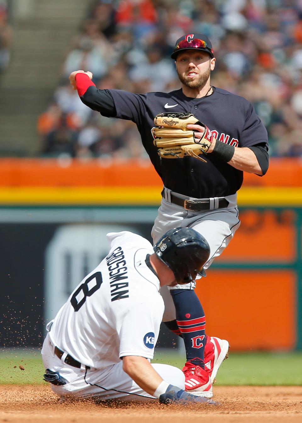 Guardians second baseman Owen Miller turns the ball after getting a force out on Tigers right fielder Robbie Grossman during the first inning on Saturday, May 28, 2022, at Comerica Park.