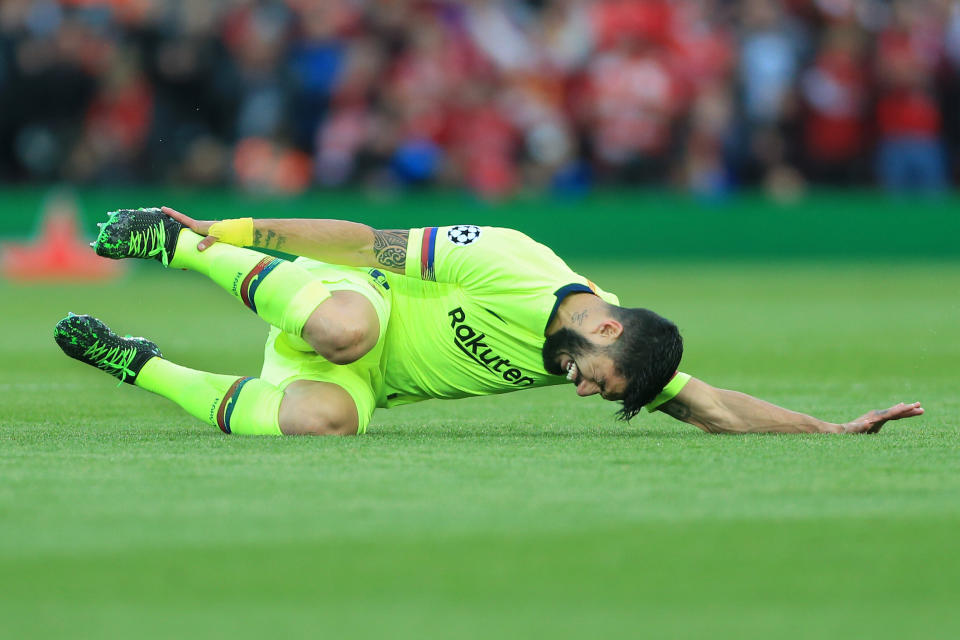 LIVERPOOL, ENGLAND - MAY 07: Luis Suarez of Barcelona writhes around in agony during the UEFA Champions League Semi Final second leg match between Liverpool and FC Barcelona at Anfield on May 7, 2019 in Liverpool, England. (Photo by Simon Stacpoole/Offside/Getty Images)