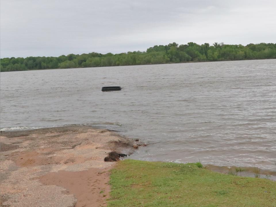 A black Jeep spotted from the shore of Lake O' the Pines in Texas.