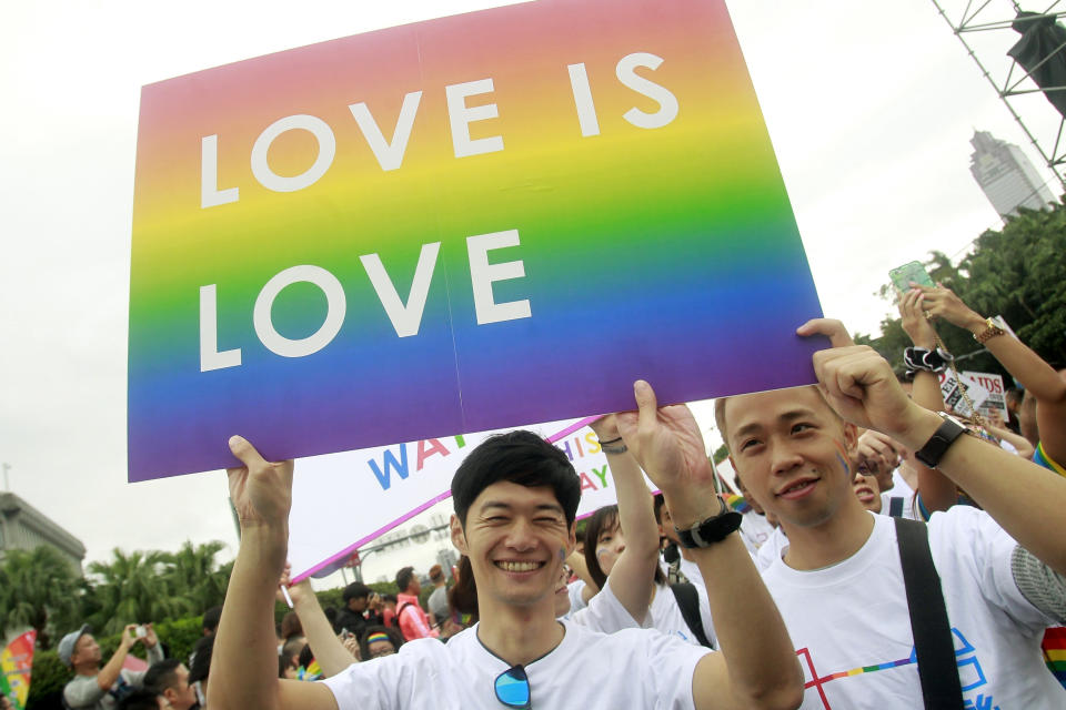 FILE - Revelers participate in a gay pride parade in Taipei, Taiwan, Oct. 31, 2015. Singapore’s announcement Sunday, Aug. 22, 2022, that it would decriminalize sex between men is being hailed as a step in the right direction for LGBTQ rights in the Asia-Pacific region, a vast area of nearly 5 billion people with different laws and attitudes. (AP Photo/Chiang Ying-ying, File)