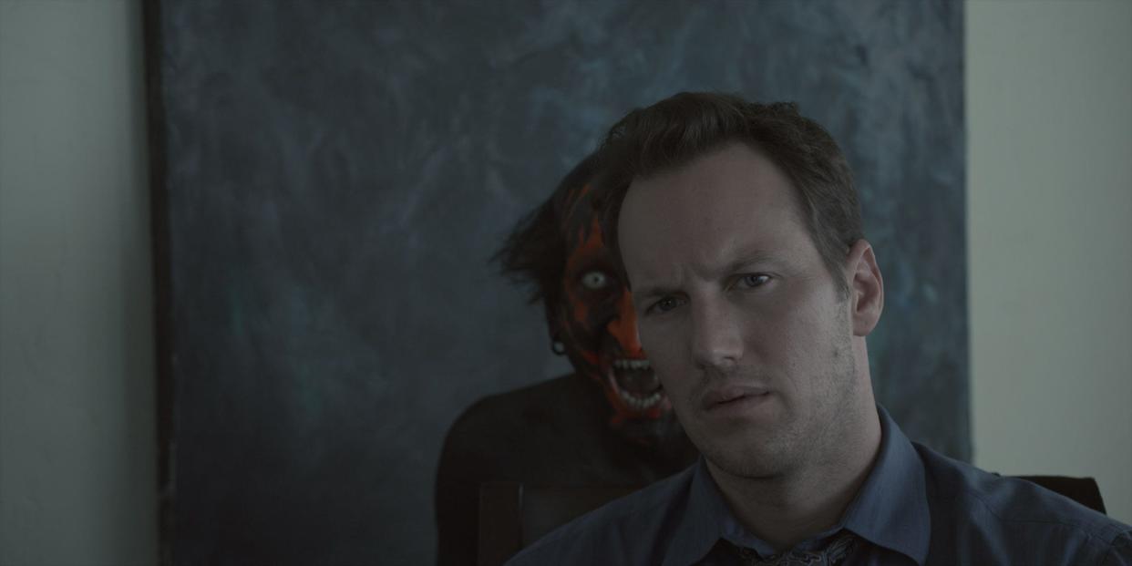 Josh Lambert (Patrick Wilson, right) is haunted by the Lipstick Face Demon (Joseph Bishara) in "Insidious."