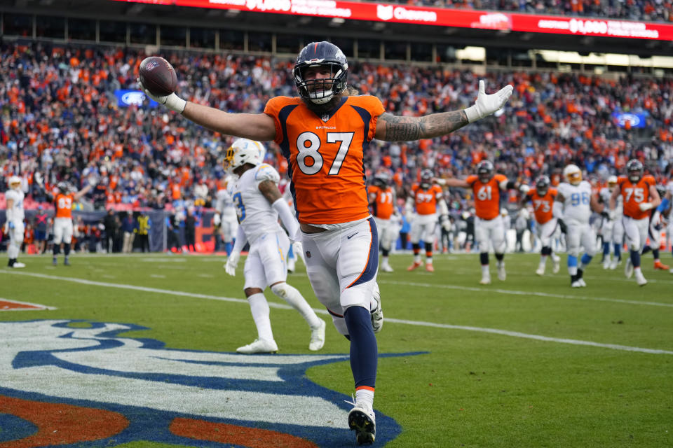 Denver Broncos tight end Eric Tomlinson (87) celebrates as he scores a touchdown against the Los Angeles Chargers during the first half of an NFL football game in Denver, Sunday, Jan. 8, 2023. (AP Photo/Jack Dempsey)