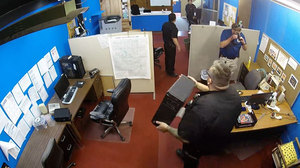 Surveillance video shows police raiding the Marion County Record's office in Kansas on Friday. - Eric Meyer