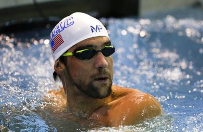 Michael Phelps checks his time in the 200 freestyle in a preliminary race at the Arena Pro Swim Series meet in Charlotte, N.C, Friday, May 15, 2015. Phelps qualified fourteenth with a time of 1:51:44. (AP Photo/Nell Redmond)