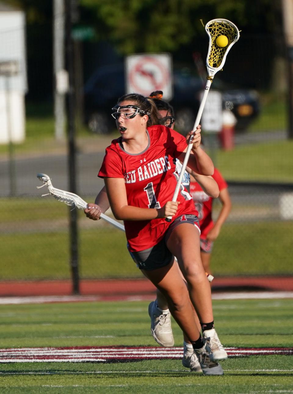 North Rockland's Olivia Castaldo (1) works the ball during the Section 1 Class A girls lacrosse championship game against Suffern at Nyack High School in Nyack on Thursday, May 25, 2023.