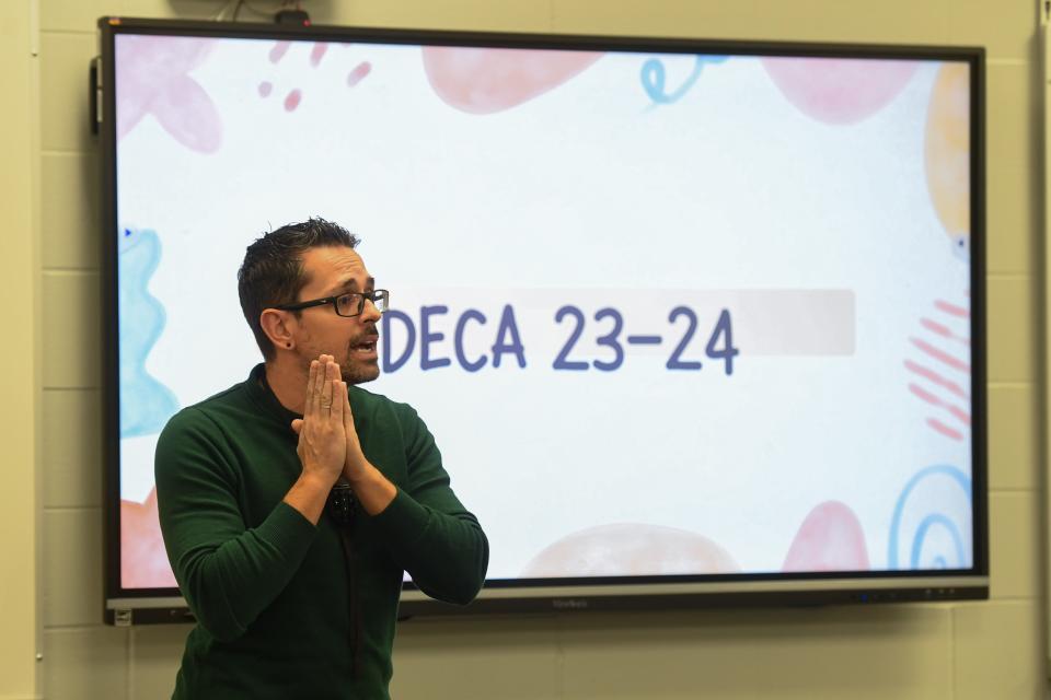 Jose González, marketing and personal finance teacher and DECA advisor at Jefferson High School speaks at the first DECA meeting on Tuesday, Nov. 28, 2023 in Sioux Falls.