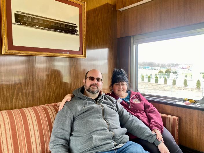 Passengers Eric and Jennifer Richardson enjoy the view from the car&#39;s lounge.