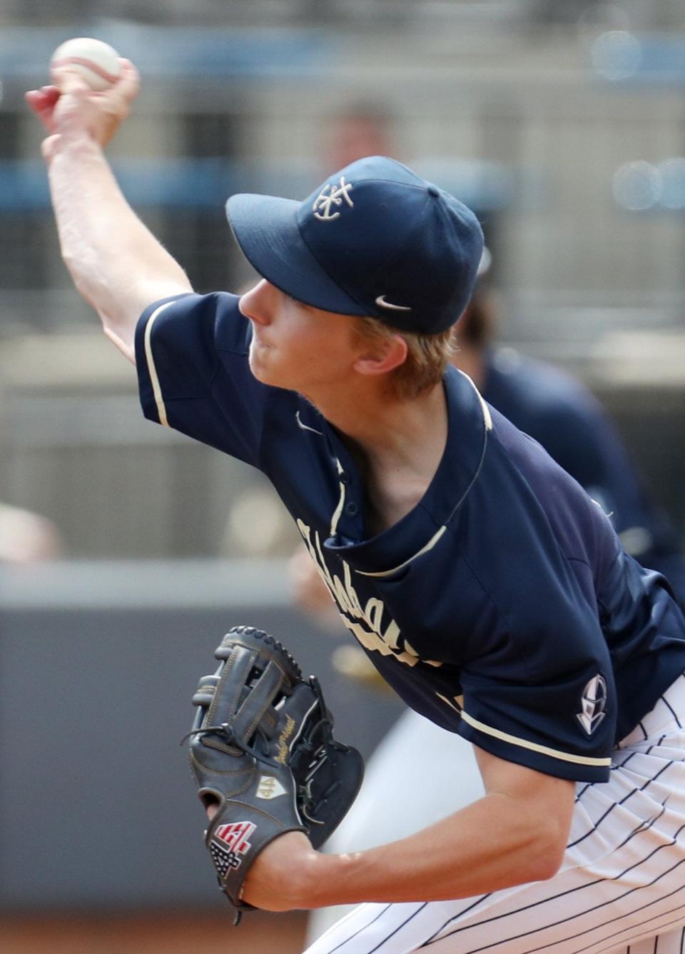 Archbishop Hoban starting pitcher Noah LaFine delivers a pitch against Badin in the first inning of a Division II baseball state semifinal game at Canal Park in Akron on Friday. Hoban beat Badin 4-3. [Mike Cardew/Akron Beacon Journal]  Photo taken on Friday June 9, 2022.