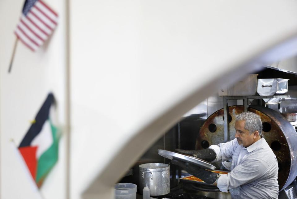 Knafeh Cafe owner Asem Abusir makes Knafeh in Anaheim.