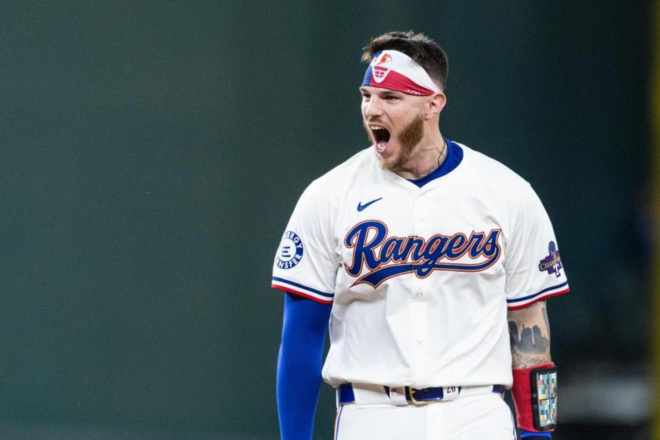 Texas Rangers catcher Jonah Heim (28) celebrates after hitting a walk off single at the bottom of the tenth inning to win their season opener against the Chicago Cubs 4-3 at Globe Life Field in Arlington on Thursday, March 28, 2024. Chris Torres/ctorres@star-telegram.com