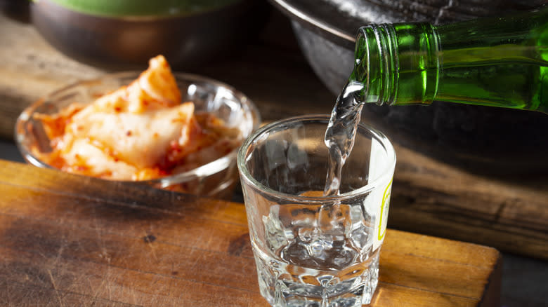 soju being poured into glass