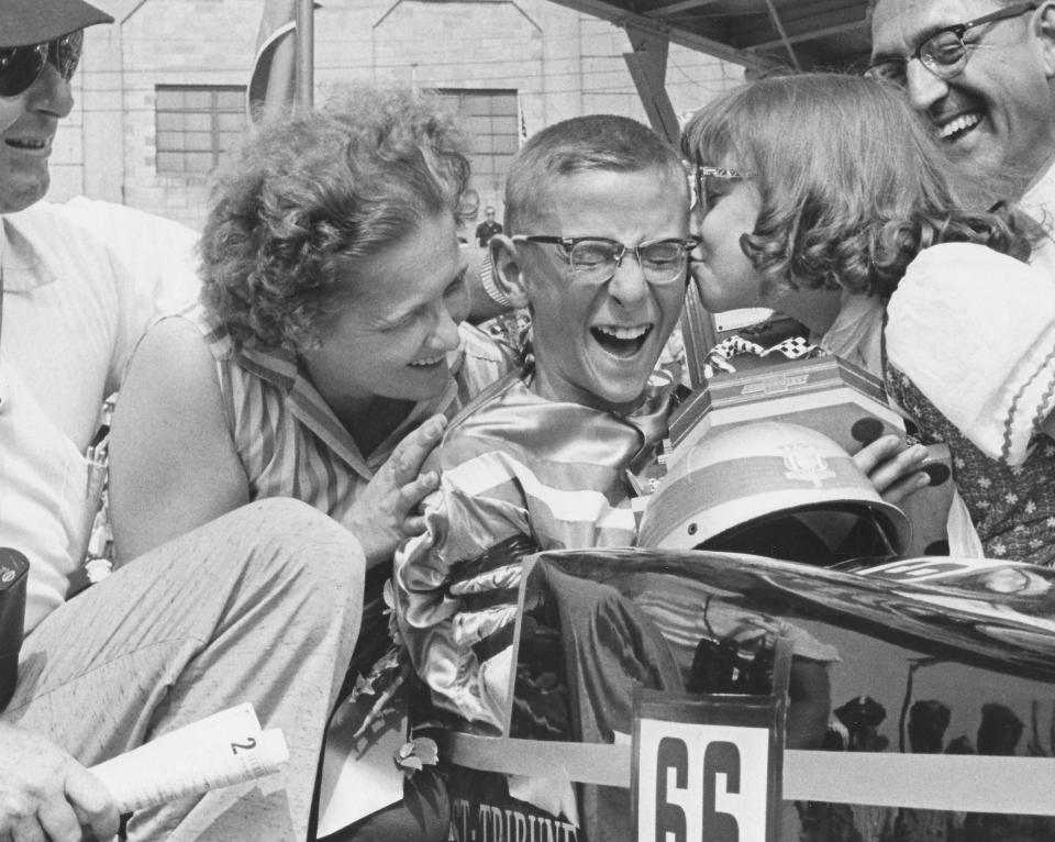 All-American Soap Box Derby champion David Mann, 14, of Valparaiso, Indiana, gets a congratulatory kiss from his sister Patty, 9, while Mr. and Mrs. Randy Mann await their turn Aug. 4, 1962, at Derby Downs in Akron.