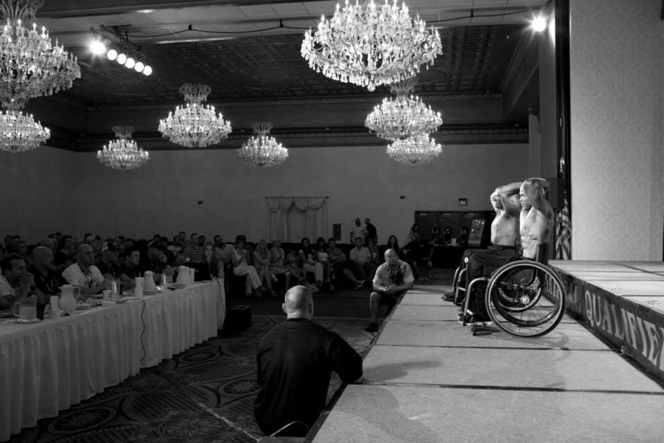 Harold Kelley and Brian Simmons pose for judges at a competition in Metairie, La. Athletes are judged by eight mandatory poses. (Photo by Lauren Fleishman for TIME) <br> <br> <a href="http://lightbox.time.com/2012/10/15/wheelchair-bodybuilders/#1" rel="nofollow noopener" target="_blank" data-ylk="slk:Click here to see the full collection and story at TIME.com;elm:context_link;itc:0;sec:content-canvas" class="link ">Click here to see the full collection and story at TIME.com</a>