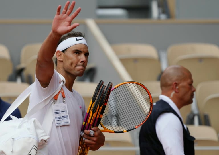 'Give my all': Rafael Nadal waves to spectators as he leaves the court after taking part in a practice session at the French Open (Dimitar DILKOFF)