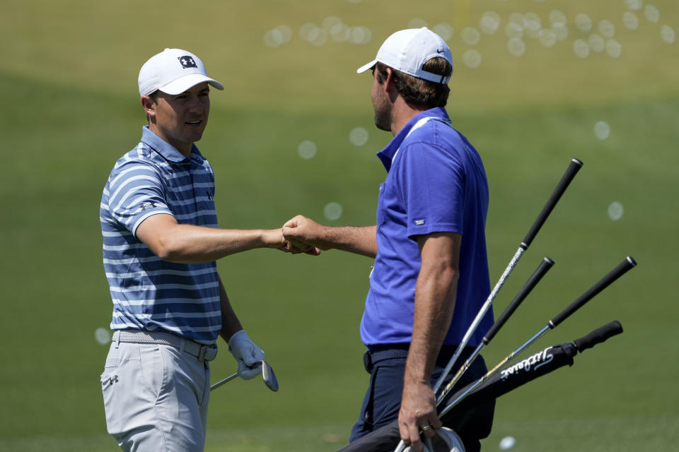 Jordan Spieth and Scottie Scheffler meet the range during a practice day for the Masters golf tournament on Monday, April 5, 2021, in Augusta, Ga. (AP Photo/David J. Phillip)