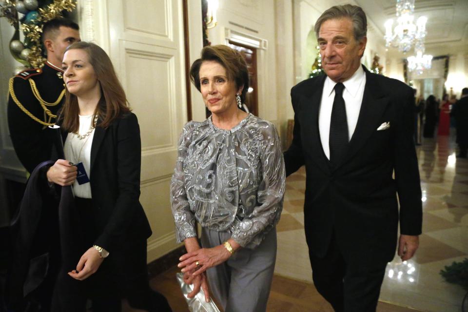 U.S. House Minority Leader Pelosi and her husband arrive for a reception for the Kennedy Center Honors recipients at the White House in Washington