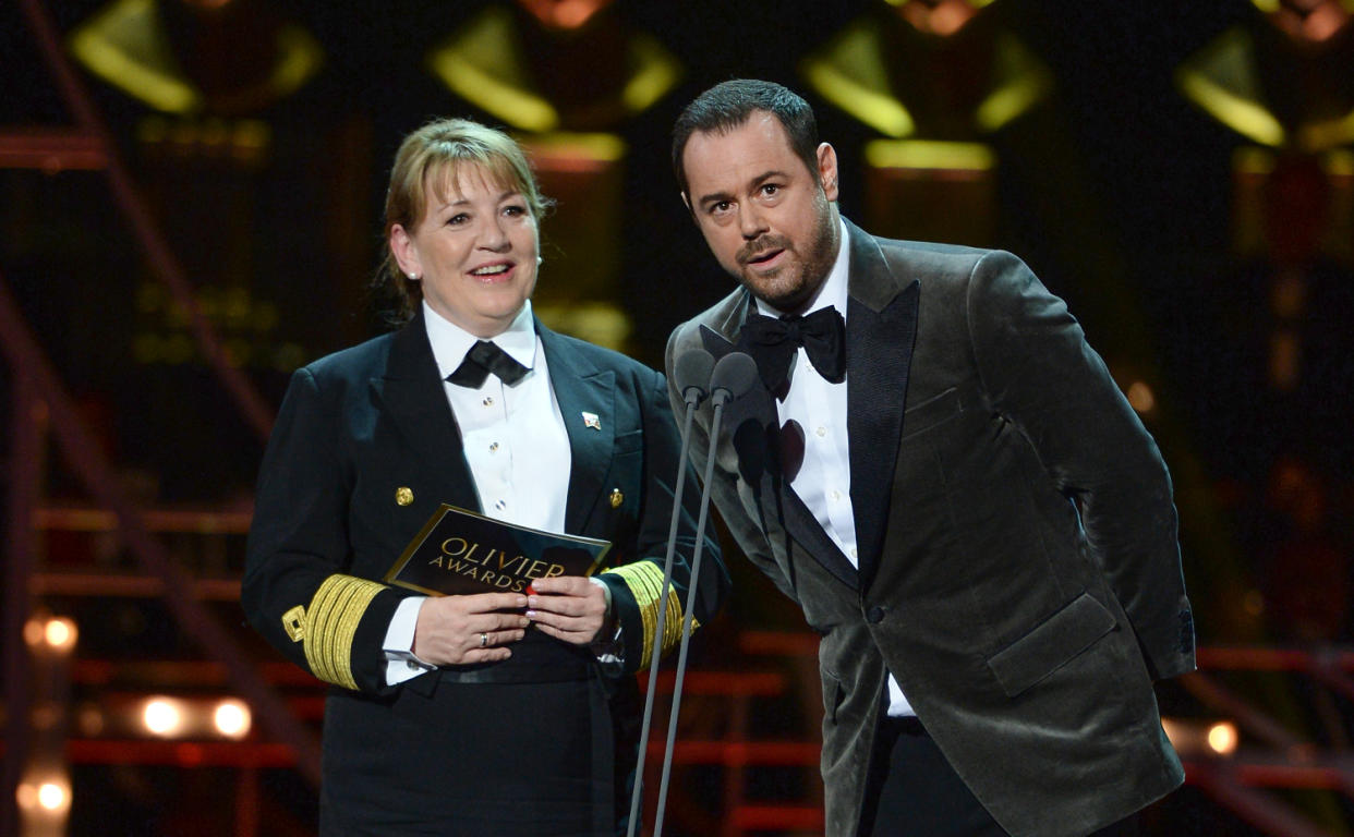 Danny Dyer (R) and Cunard Captain Inger Klein Thorhauge on stage during The Olivier Awards 2019 with Mastercard at the Royal Albert Hall on April 07, 2019 in London, England. (Photo by Jeff Spicer/Getty Images)