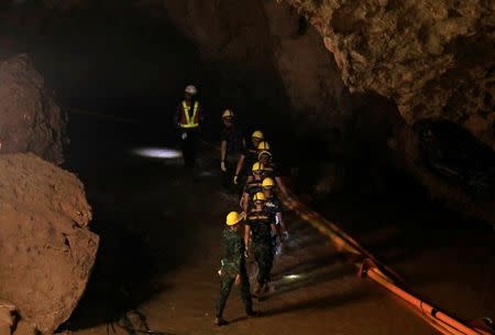 Soldiers walk after 12 soccer players and their coach were rescued near Tham Luang cave complex in the northern province of Chiang Rai, Thailand, July 10, 2018. REUTERS/Soe Zeya Tun