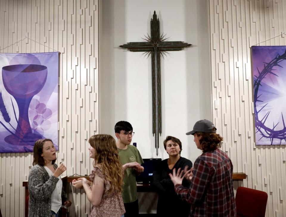 Students gather in church.