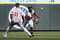 Atlanta Braves center fielder Michael Harris II runs to catch a fly ball for an out on a ball hit by Seattle Mariners' Jorge Polanco with Orlando Arcia left, during the ninth inning of a baseball game, Wednesday, May 1, 2024, in Seattle. The Braves won 5-2. (AP Photo/John Froschauer)