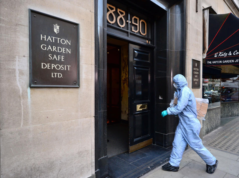 A 2015 photo of a police forensics officer entering the Hatton Garden Safe Deposit company(PA Wire)