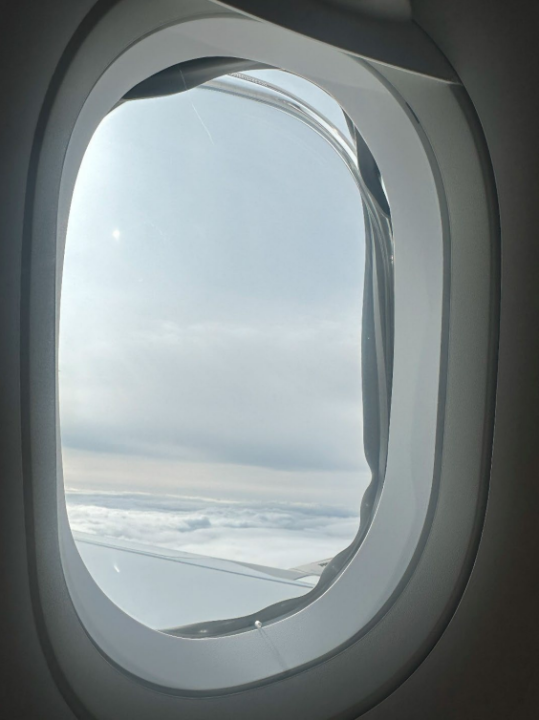 “View of the left side cabin window aft of the overwing exit.” (AAIB)