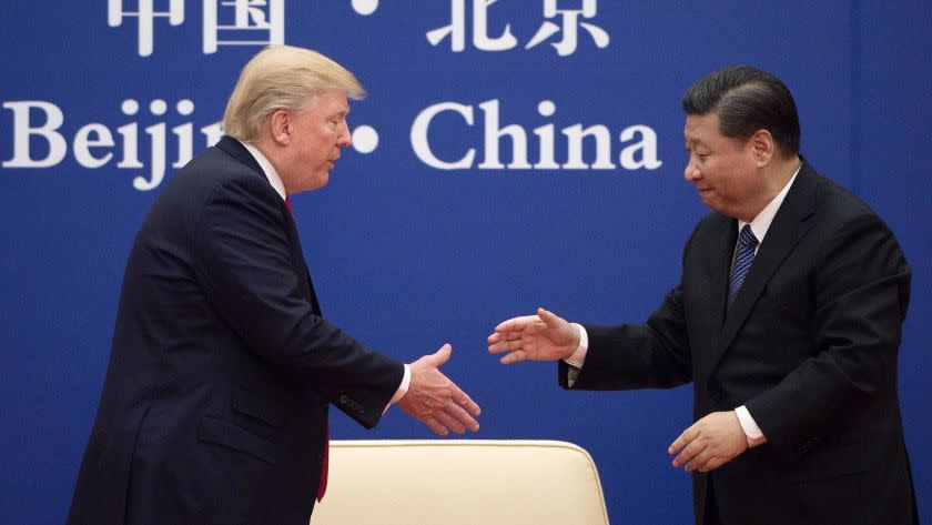 (FILES) In this file photo taken on November 9, 2017 China's President Xi Jinping shakes hands with US President Donald Trump (L) during a business leaders event at the Great Hall of the People in Beijing. - US President Donald Trump said June 18, 2019 he had a positive phone conversation with his Chinese counterpart Xi Jinping and that they will hold an "extended meeting" next week at the G20 summit. Trump's tweet set a more upbeat tone for his talks with Xi at the summit in Japan after growing questions over whether the world's two leading economies will be able to resolve their differences and end a huge trade war."Had a very good telephone conversation with President Xi of China. We will be having an extended meeting next week at the G-20 in Japan. Our respective teams will begin talks prior to our meeting," Trump said. (Photo by Nicolas ASFOURI / AFP)NICOLAS ASFOURI/AFP/Getty Images ** OUTS - ELSENT, FPG, CM - OUTS * NM, PH, VA if sourced by CT, LA or MoD **