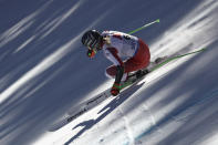 Austria's Cornelia Huetter speeds down the course during an alpine ski, women's World Championships super G, in Meribel, France, Wednesday, Feb. 8, 2023. (AP Photo/Gabriele Facciotti)