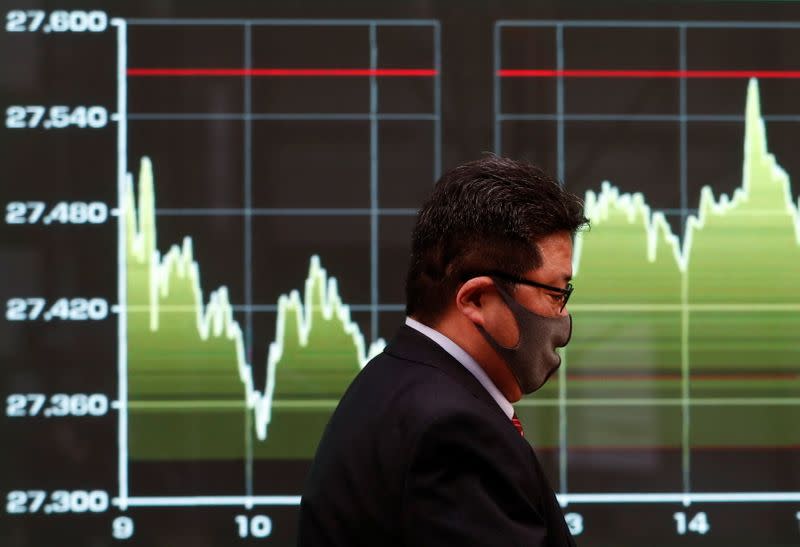 Screen displays recent Nikkei share average movements outside a brokerage in Tokyo