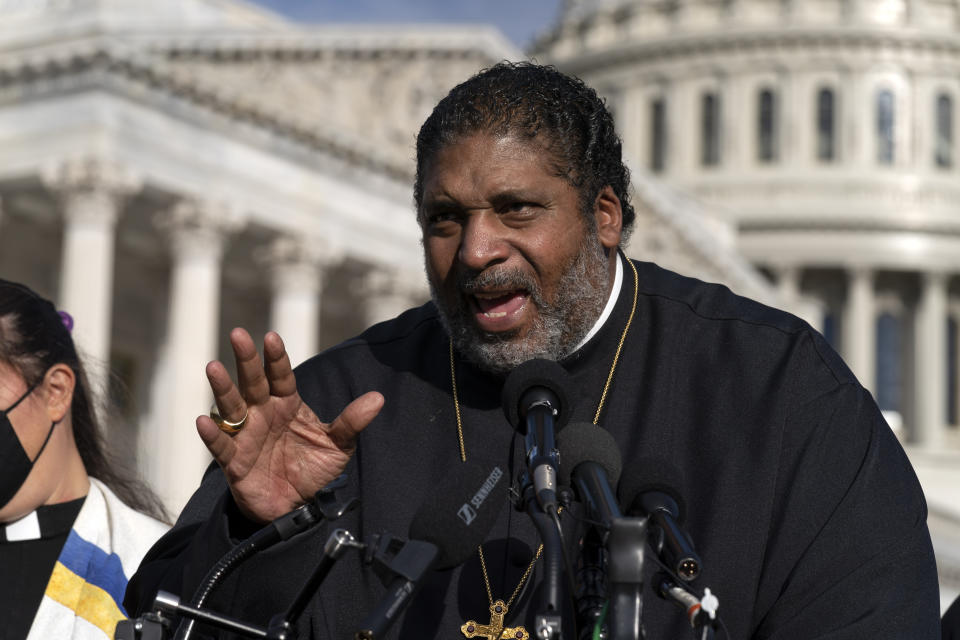 FILE - The Rev. William Barber and the Poor People's Campaign talk to reporters about the need for the "Build Back Better" plan, voting rights, health care, immigrant rights and action on climate change, during a news conference on Capitol Hill in Washington, Wednesday, Oct. 27, 2021. Barber was escorted by police out of a North Carolina movie theater, Tuesday, Dec. 26, 2023, after he insisted on using his own chair for medical reasons, prompting an apology from the nation's largest movie theater chain. (AP Photo/Jose Luis Magana, File)