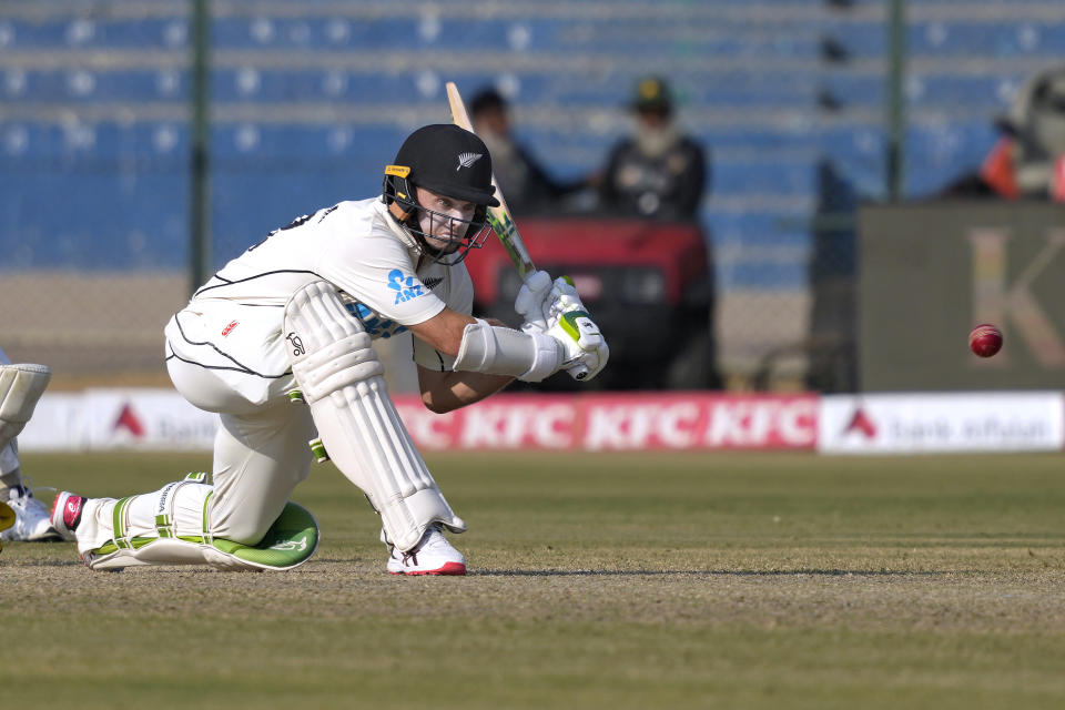New Zealand's Tom Latham plays a shot during the second day of first test cricket match between Pakistan and New Zealand, in Karachi, Pakistan, Tuesday, Dec. 27, 2022. (AP Photo/Fareed Khan)