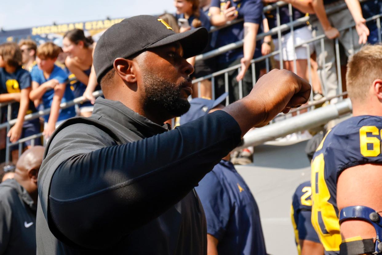 Michigan Wolverines head coach Sherrone Moore walks off the field after a 28-18 win against the Arkansas State Red Wolves at Michigan Stadium in Ann Arbor on Saturday, Sept. 14, 2024.