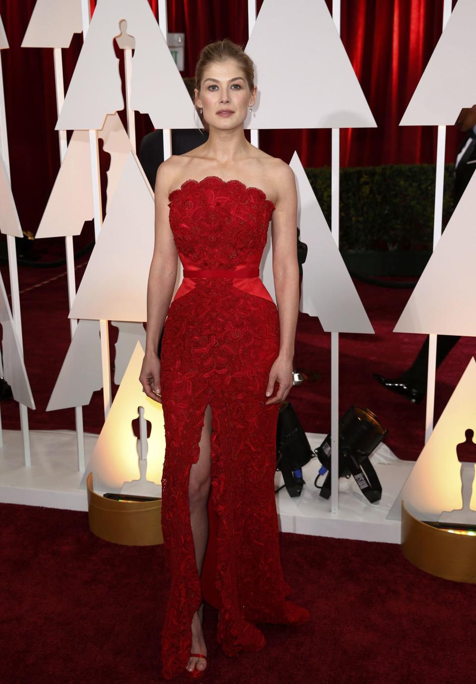Best actress nominee Pike poses on the red carpet as she arrives at the 87th Academy Awards in Hollywood