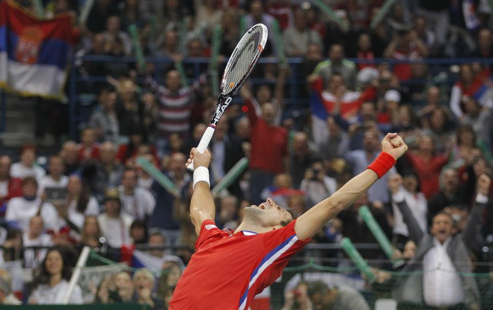 Novak Djokovic celebrated after beating Tomas Berdych of Serbia during the Davis Cup final last November. He won't be there this weekend to help keep Serbia in the World Group. (Photo by Srdjan Stevanovic/Getty Images)