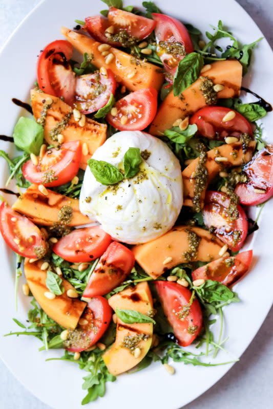 <p>Daisy Beet</p><p>This burrata salad is super simple to whip up. This recipe will impress your guests with its vibrant colors and delicious summer flavor!</p><p><strong>Get the recipe: <a href="https://www.daisybeet.com/burrata-salad-with-tomatoes-and-melon-gluten-free/" rel="nofollow noopener" target="_blank" data-ylk="slk:Burrata Salad with Tomatoes and Melon;elm:context_link;itc:0;sec:content-canvas" class="link rapid-noclick-resp"><em>Burrata Salad with Tomatoes and Melon</em></a></strong></p>