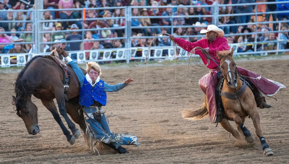 Jackson Lunn, of Mid-Plains (Neb.) Community College, got tangled in rigging during bareback riding. His horse dragged him around the arena until others were able to help disentangle him from the moving animal.