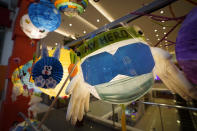 A lantern, right, featuring medical staff with a face mask, is displayed with others during the Mid-Autumn Festival in Kuala Lumpur, Tuesday, Sept. 29, 2020. The festival falls on the 15th day of the 8th lunar month of the Chinese calendar and is marked by Chinese families and friends gathering to eat Chinese moon cakes and pomelos together. (AP Photo/Vincent Thian)