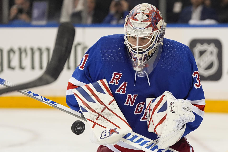 New York Rangers goaltender Igor Shesterkin (31) blocks a shot attempt by the Florida Panthers during the third period of Game 1 of the NHL hockey Eastern Conference Stanley Cup playoff finals, Wednesday, May 22, 2024, in New York. (AP Photo/Julia Nikhinson)