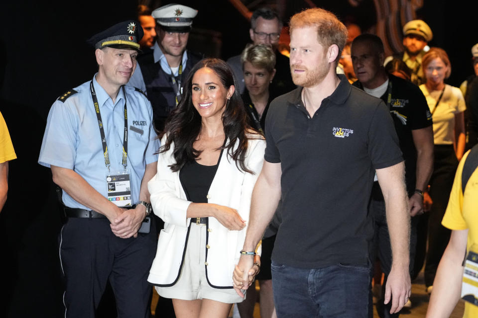 Britain's Prince Harry, right, and Meghan, Duchess of Sussex, arrive to a wheelchair basketball match at the Invictus Games in Duesseldorf, Germany, Wednesday, Sept. 13, 2023. Harry founded the Invictus Games to aid the rehabilitation of service members and veterans by giving them the challenge of competing in sports events similar to the Paralympics. (AP Photo/Martin Meissner)