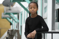 Ezekiel West, 10, stands for a portrait outside his home in Los Angeles on Sunday, Jan. 15, 2023. At least three of the students that lawyer Allison Hertog has represented, including Ezekiel, have disappeared from school for long periods since schools resumed in-person instruction. Their situations were avoidable, she said: “It’s pretty disgraceful that the school systems allowed this to go on for so long.” (AP Photo/Damian Dovarganes)