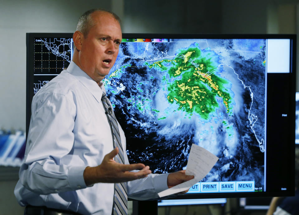 Ken Graham, director of the National Hurricane Center speaks during a broadcast, Tuesday, Sept. 4, 2018, at the hurricane center in Miami. Boaters evacuated to safe harbors, and motorists fled barrier islands Tuesday as the Gulf Coast hustled to get ready for Tropical Storm Gordon, which was on track to hit Mississippi as a Category 1 hurricane sometime after nightfall. (AP Photo/Wilfredo Lee)