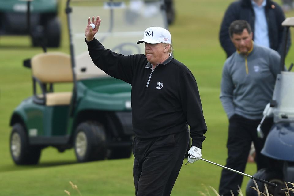 TURNBERRY, SCOTLAND - JULY 15:  U.S. President Donald Trump waves whilst playing a round of golf at Trump Turnberry Luxury Collection Resort during the U.S. President's first official visit to the United Kingdom on July 15, 2018 in Turnberry, Scotland. The President of the United States and First Lady, Melania Trump on their first official visit to the UK after yesterday's meetings with the Prime Minister and the Queen is in Scotland for private weekend stay at his Turnberry.  (Photo by Leon Neal/Getty Images)